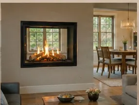 Two-sided gas fireplace installed through an interior wall